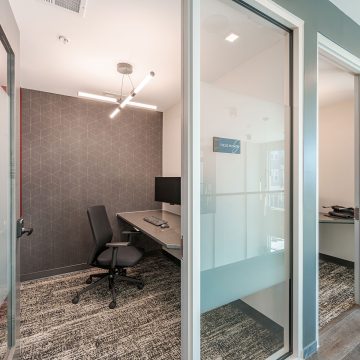 A quiet focus room to get away from distractions, with a desk chair, keyboard and monitor.