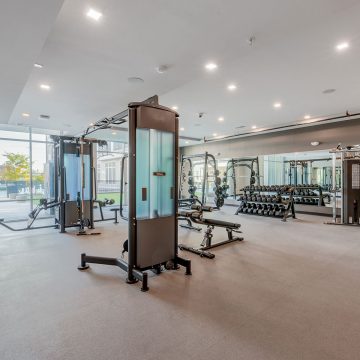 Racks of dumbells in various weights along with weight machines.